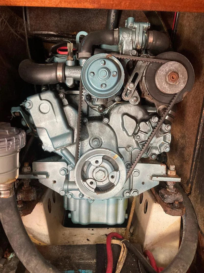 Slide: The Image of Engine of a 2005 Beneteau Oceanis 473 sailboat, showcasing belts and components. - 15