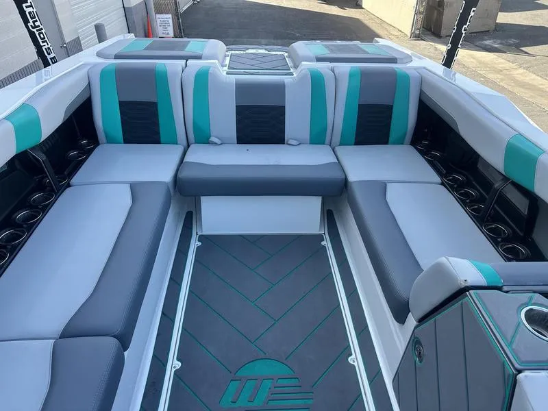 Slide: The Image of 2023 Malibu 26 LSV boat interior with modern seating and stylish design. - 10