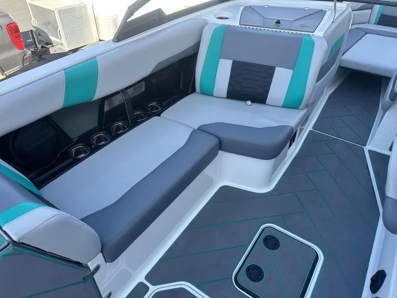 Slide: The Image of 2023 Malibu 26 LSV boat interior with stylish seating and modern design. - 13