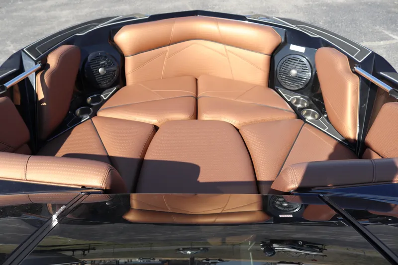 Slide: The Image of 2020 Centurion Fi23 boat with brown leather seating and built-in speakers. - 10