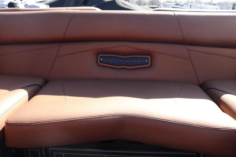 Slide: The Image of 2020 Centurion Fi23 boat interior seating with brown leather upholstery. - 12