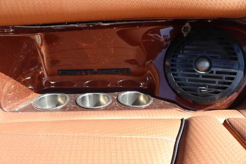 Slide: The Image of Centurion Fi23 2020 boat interior with cup holders and speaker. - 13