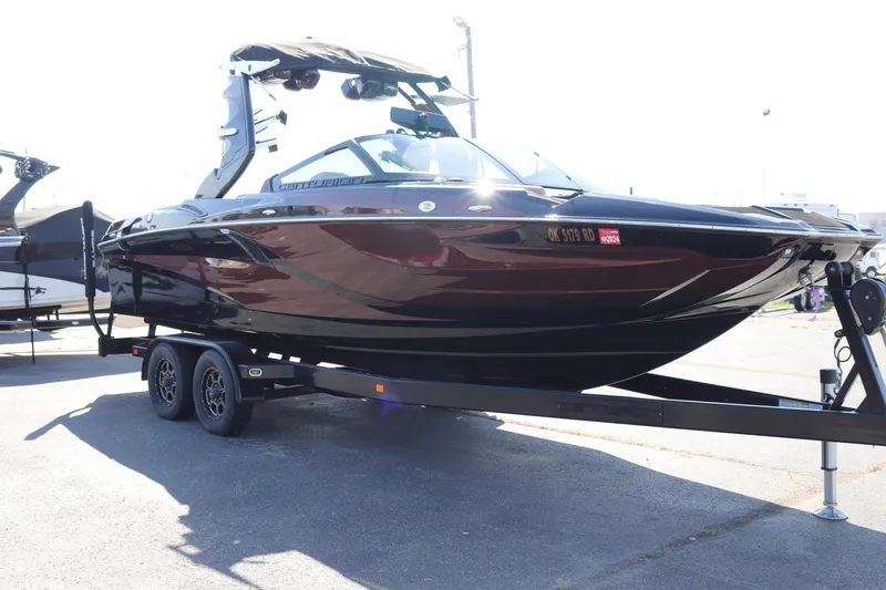 Slide: The Image of 2020 Centurion Fi23 boat on a trailer in a parking lot. - 3