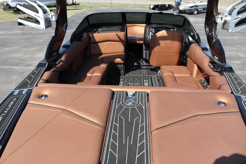 Slide: The Image of 2020 Centurion Fi23 boat interior with brown leather seats and black accents. - 5