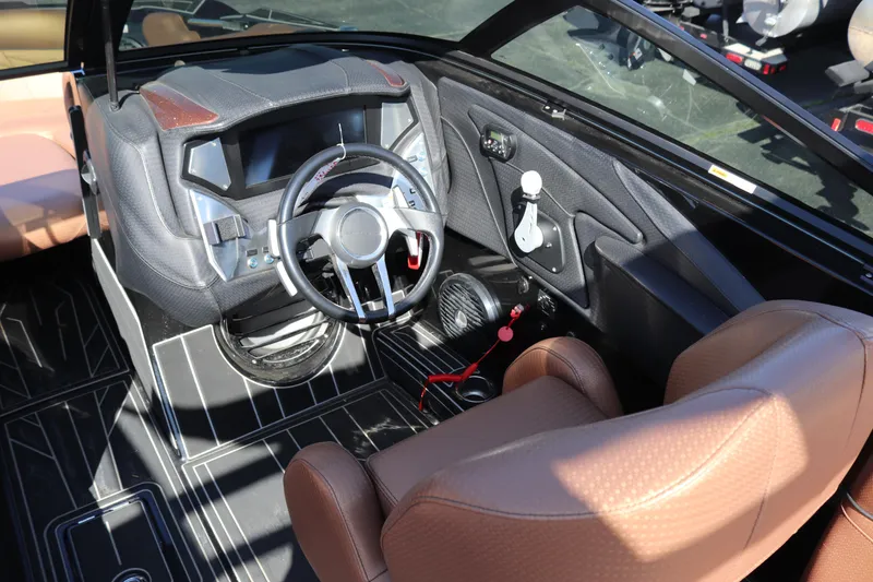 Slide: The Image of 2020 Centurion Fi23 boat cockpit with modern steering wheel and brown leather seats. - 7