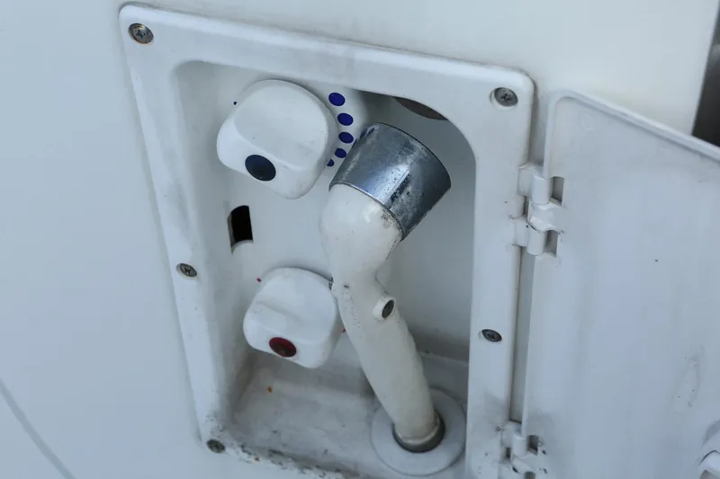 Slide: The Image of 2004 Sea Ray 290 Amberjack boat shower controls and nozzle. - 11
