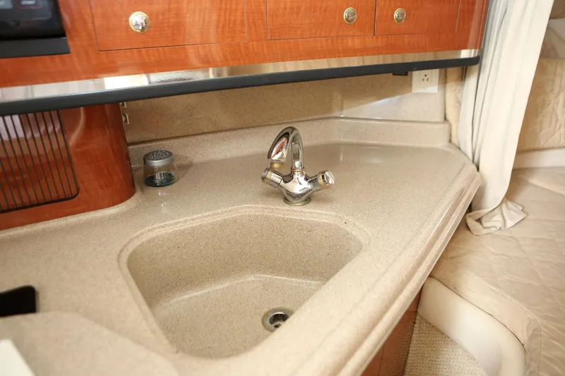 Slide: The Image of 2004 Sea Ray 290 Amberjack kitchen sink and countertop area - 26