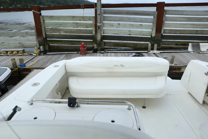 Slide: The Image of 2004 Sea Ray 290 Amberjack boat at dock with white seating. - 3