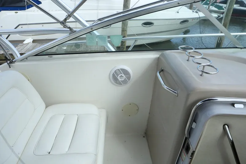 Slide: The Image of Interior seating and control panel of a 2004 Sea Ray 290 Amberjack boat. - 8