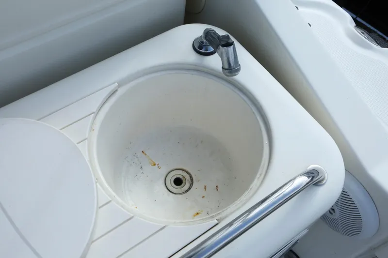 Slide: The Image of 2004 Sea Ray 290 Amberjack boat sink and faucet. - 9