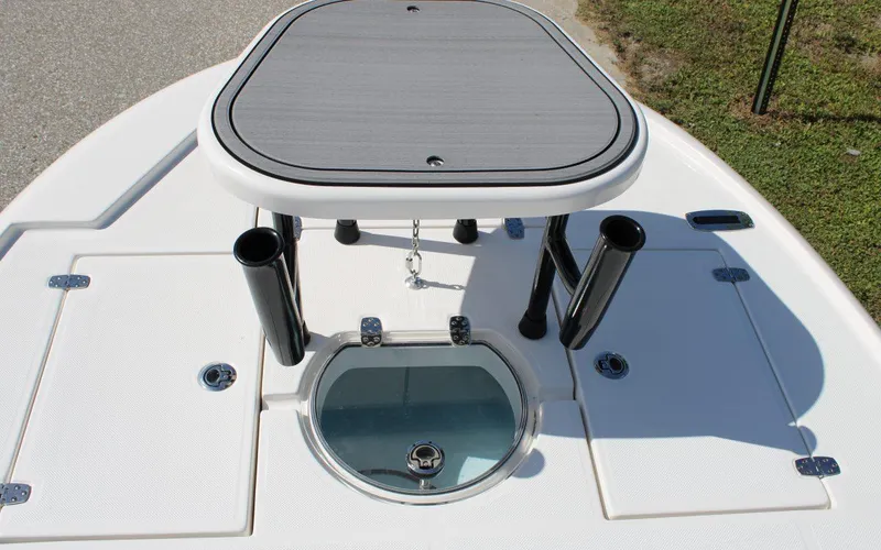 Slide: The Image of 2024 Spyder FX19 Vapor boat deck with storage compartments and rod holders. - 11