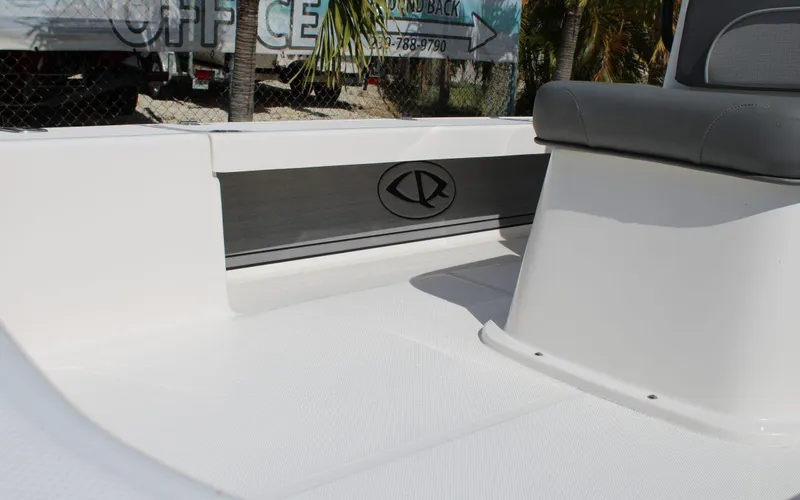 Slide: The Image of 2024 Spyder FX19 Vapor boat interior with seating and logo. - 13