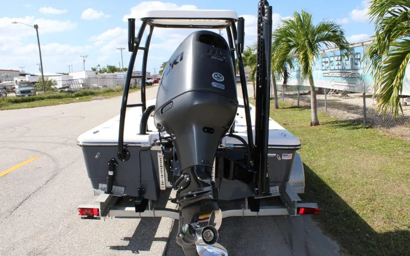 Slide: The Image of 2024 Spyder FX19 Vapor boat with outboard motor on trailer. - 4