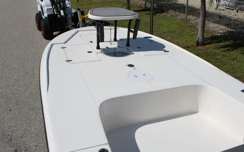 Slide: The Image of 2024 Spyder FX19 Vapor boat deck with seating and storage compartments. - 6