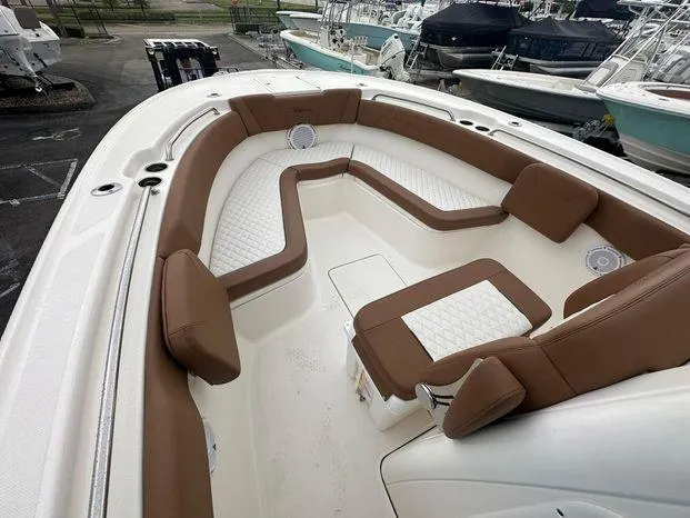 Slide: The Image of 2024 Pioneer 270 Pelagic boat with spacious seating and white-brown upholstery. - 7