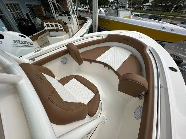 Slide: The Image of 2024 Pioneer 202 Islander boat with brown and white seating. - 5