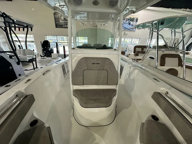 Slide: The Image of 2024 Sea Pro 239 Sport boat interior with seating and console. - 6
