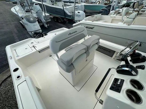 Slide: The Image of 2024 Avenger 26 Avenger boat interior with dual seats and control panel. - 7