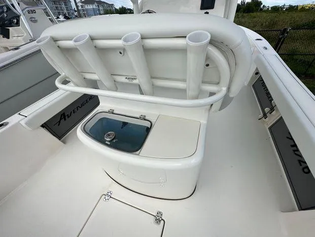 Slide: The Image of 2024 Avenger 26 Avenger boat interior with rod holders and storage compartments. - 8