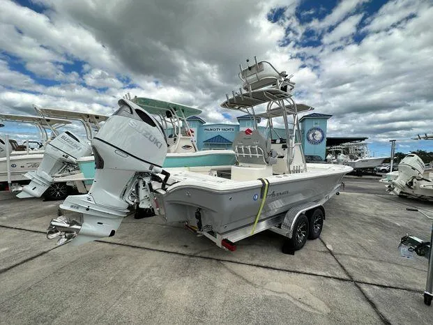 Slide: The Image of 2024 Avenger 26 Avenger boat with Suzuki outboard motor on trailer. - 3