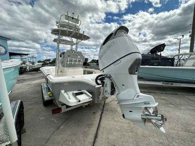 Slide: The Image of 2024 Avenger 26 Avenger boat with Suzuki outboard motor on trailer. - 4
