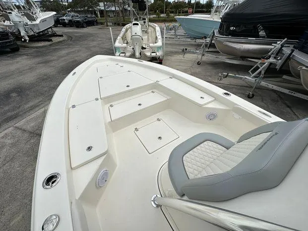 Slide: The Image of 2024 Avenger 26 Avenger boat, spacious deck, comfortable seating, docked at marina. - 6
