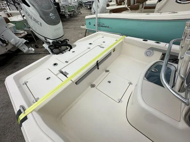 Slide: The Image of 2024 Avenger 26 Avenger boat deck with Suzuki outboard motor. - 9