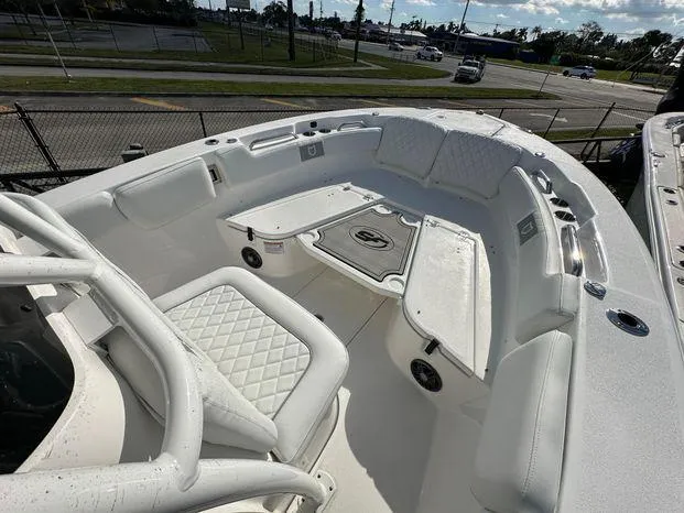 Slide: The Image of 2024 Sea Fox 248 Commander boat interior with white seating and deck. - 5