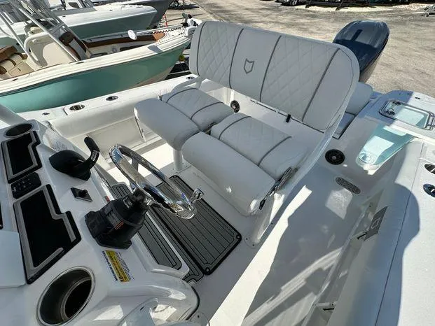 Slide: The Image of 2024 Sea Fox 248 Commander boat interior with dual seats and steering console. - 9
