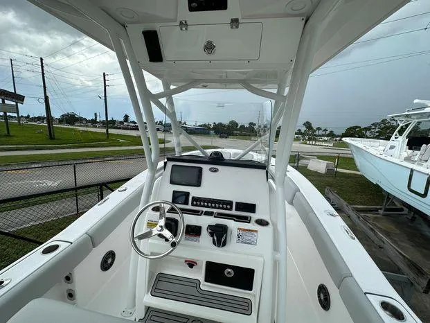 Slide: The Image of 2024 Sea Fox 248 Commander boat cockpit with steering wheel and control panel. - 3