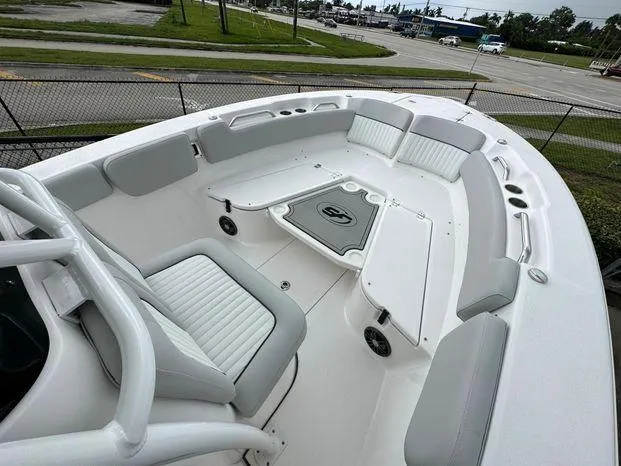 Slide: The Image of 2024 Sea Fox 248 Commander boat interior with cushioned seating and storage compartments. - 4