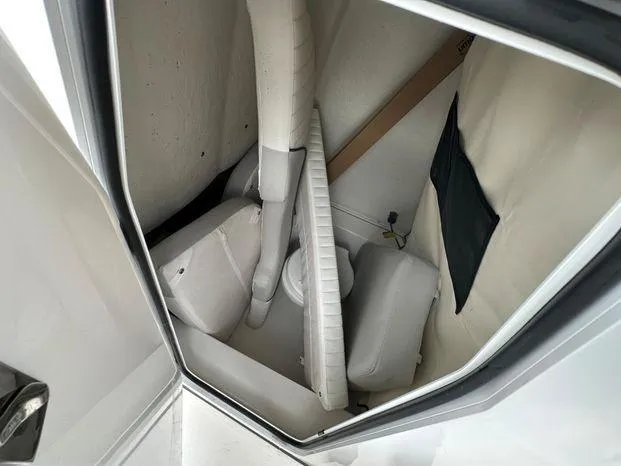 Slide: The Image of 2024 Sea Fox 248 Commander storage compartment with cushions and accessories. - 6