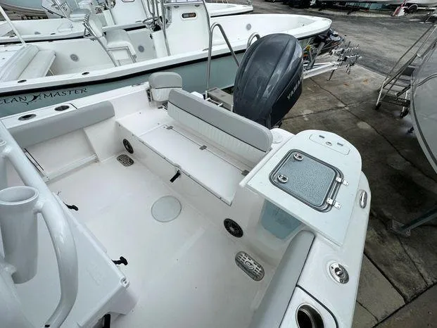 Slide: The Image of 2024 Sea Fox 248 Commander boat interior with seating and storage compartments. - 8