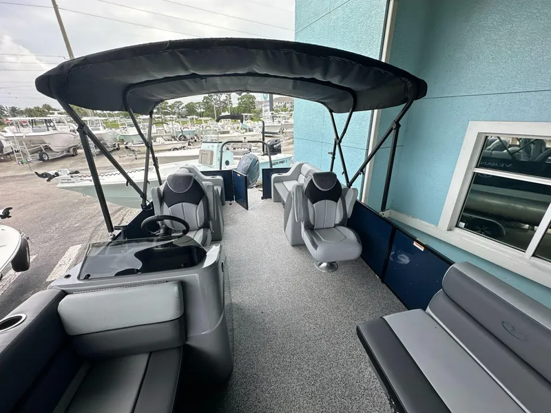 Slide: The Image of 2022 Veranda VISTA VIEW 22RC pontoon boat interior with seating and canopy. - 8