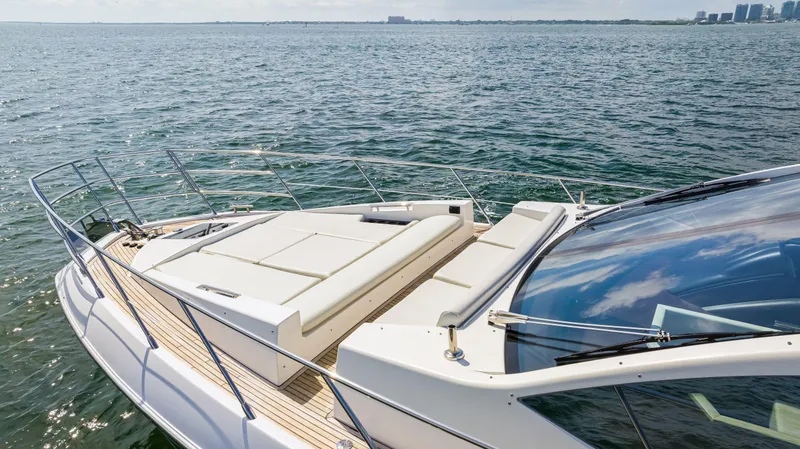 Slide: The Image of 2016 Azimut 55S yacht on open water with sunbathing deck. - 10