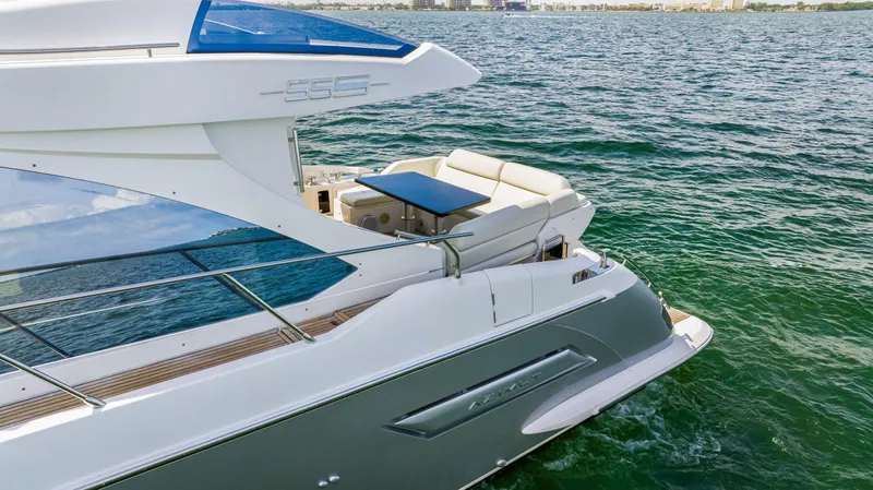 Slide: The Image of 2016 Azimut 55S yacht on water, featuring a sleek design and outdoor seating area. - 11