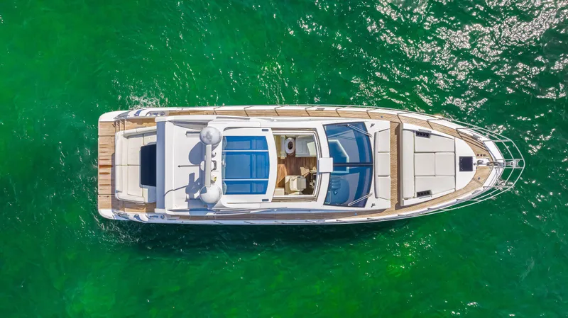 Slide: The Image of Top view of 2016 Azimut 55S yacht on clear green water. - 16