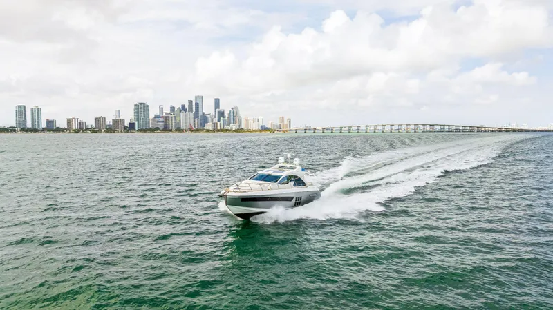 Slide: The Image of 2016 Azimut 55S yacht cruising near city skyline and bridge. - 21
