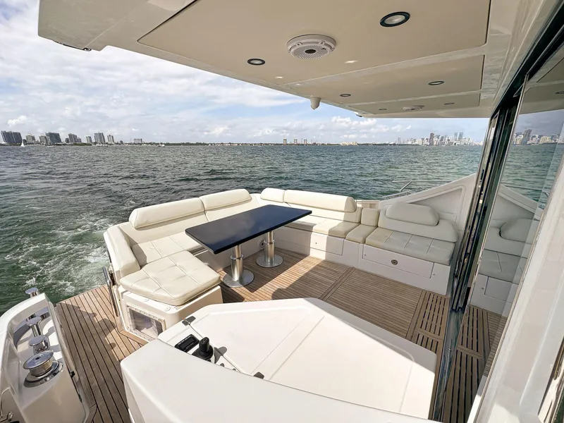 Slide: The Image of 2016 Azimut 55S yacht with spacious outdoor seating and ocean view. - 25