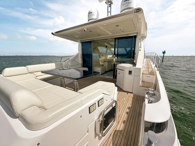 Slide: The Image of 2016 Azimut 55S yacht with spacious deck and luxurious seating. - 26