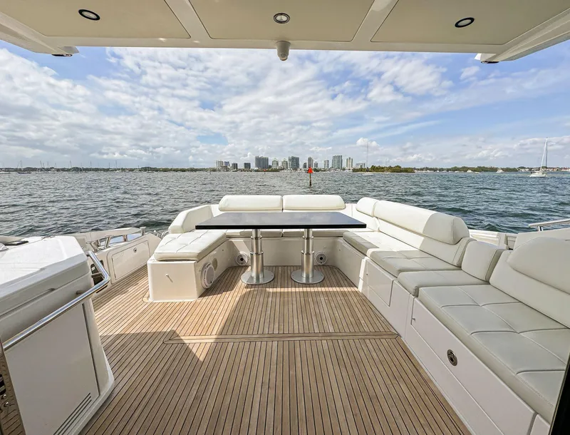 Slide: The Image of Luxurious 2016 Azimut 55S yacht with spacious deck and waterfront city view. - 27