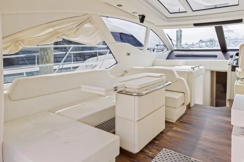 Slide: The Image of Luxurious interior of a 2016 Azimut 55S yacht with white leather seating and wooden flooring. - 28