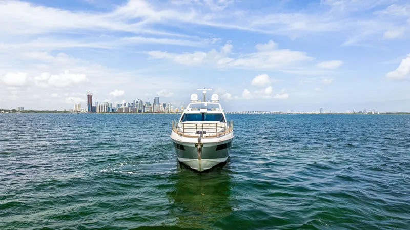 Slide: The Image of Azimut 55S 2016 yacht on open water with city skyline in background. - 3