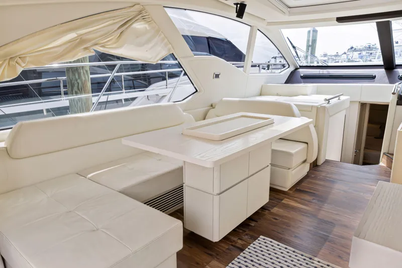 Slide: The Image of Luxurious interior of 2016 Azimut 55S yacht with white leather seating and wooden flooring. - 33