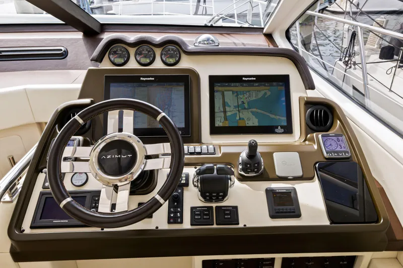 Slide: The Image of 2016 Azimut 55S yacht helm with advanced navigation systems and controls. - 37