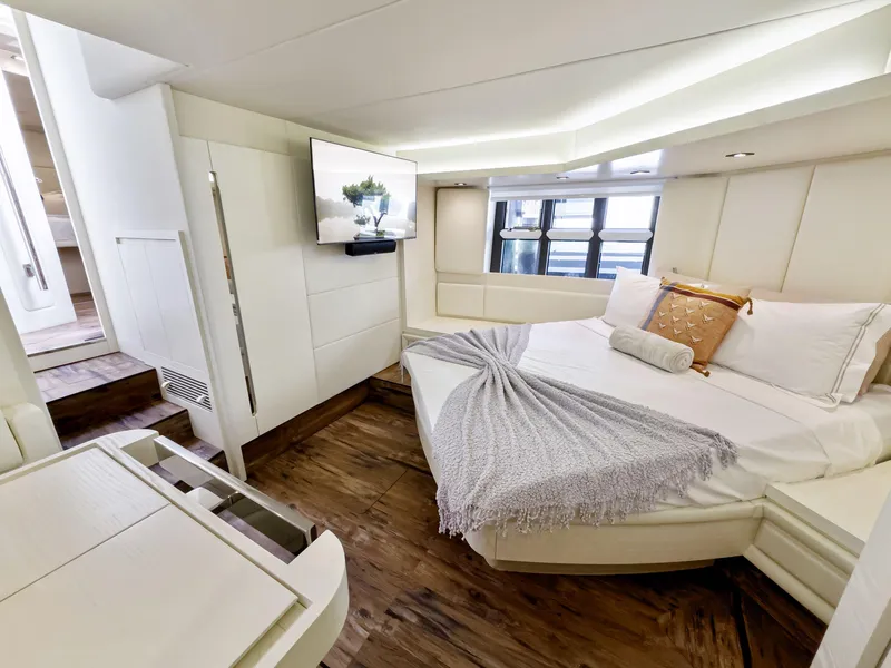 Slide: The Image of Luxurious bedroom interior of 2016 Azimut 55S yacht with modern decor and wooden flooring. - 42