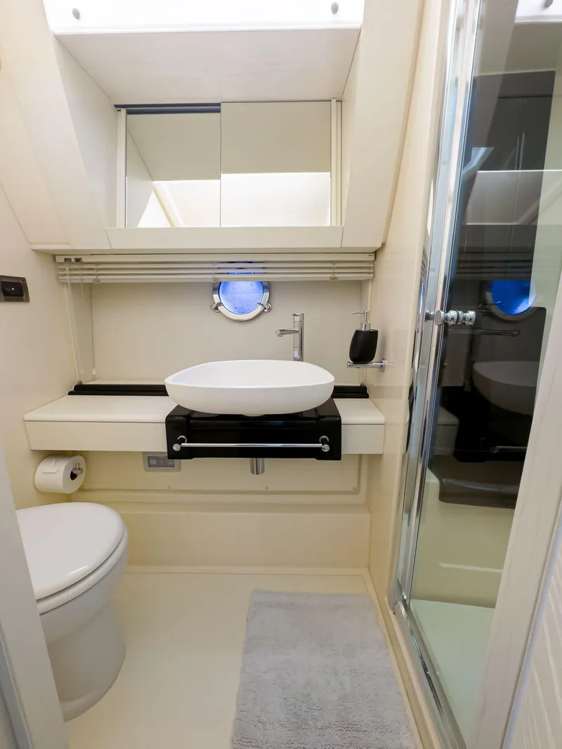 Slide: The Image of Modern bathroom in a 2016 Azimut 55S yacht with sleek fixtures and a glass shower. - 45