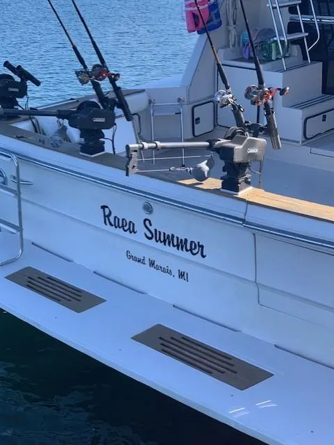 Slide: The Image of 1987 Sea Ray 460 Convertible boat named "Raea Summer" docked in Grand Marais, MI. - 25