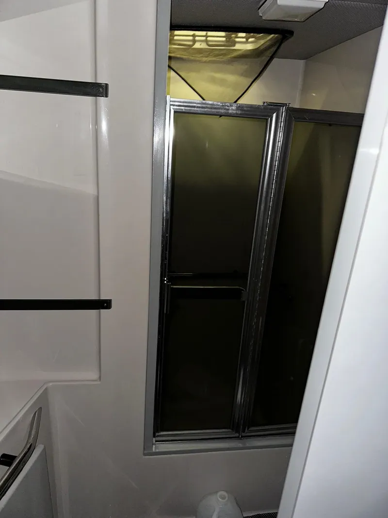 Slide: The Image of Interior of 1987 Sea Ray 460 Convertible, featuring a shower with sliding glass doors. - 39