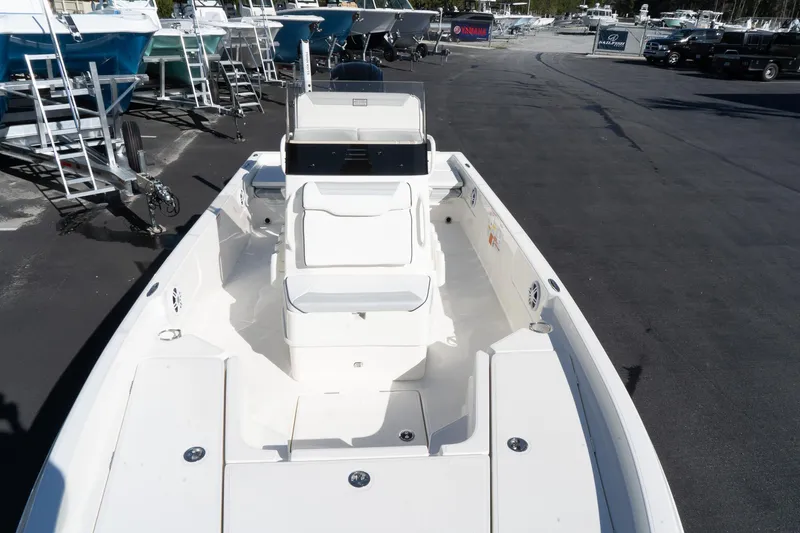 Slide: The Image of 2024 Skeeter SX 210 boat, front deck view at a marina. - 11